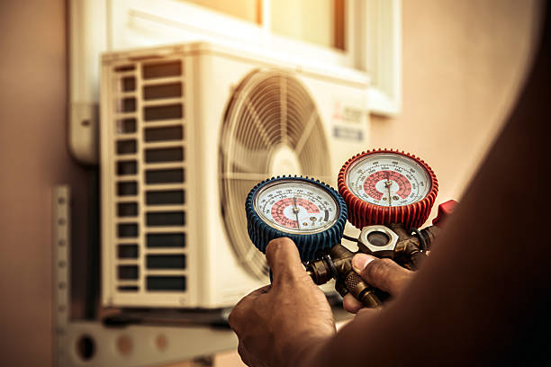Professional Air Conditioning Service technician working in Sacaton, AZ